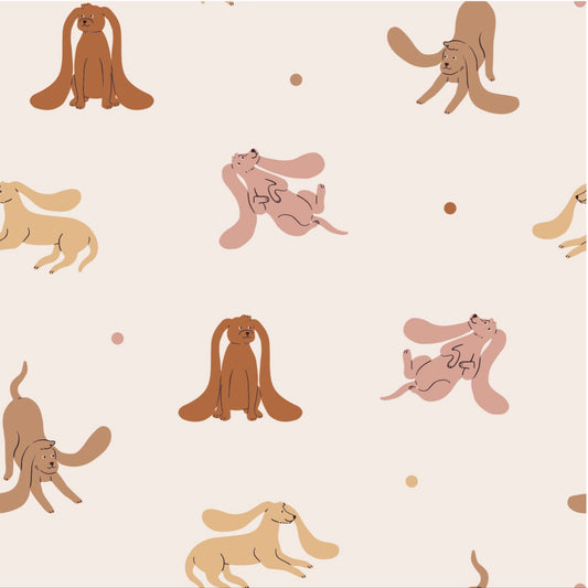 Matuu Floppy Dogs wallpaper in cream – playful dog illustrations in beige, pink and brown on a soft neutral background