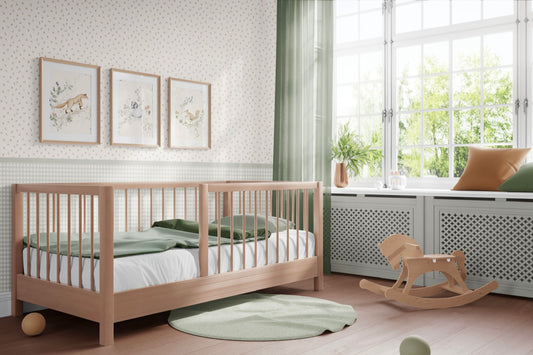 Matuu Rowan Garden wallpaper in a baby nursery with light wooden furniture and natural decor