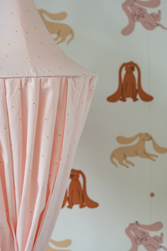 Close-up of the Matuu blush pink canopy with soft star pattern, perfect for Scandinavian or boho nursery decor.