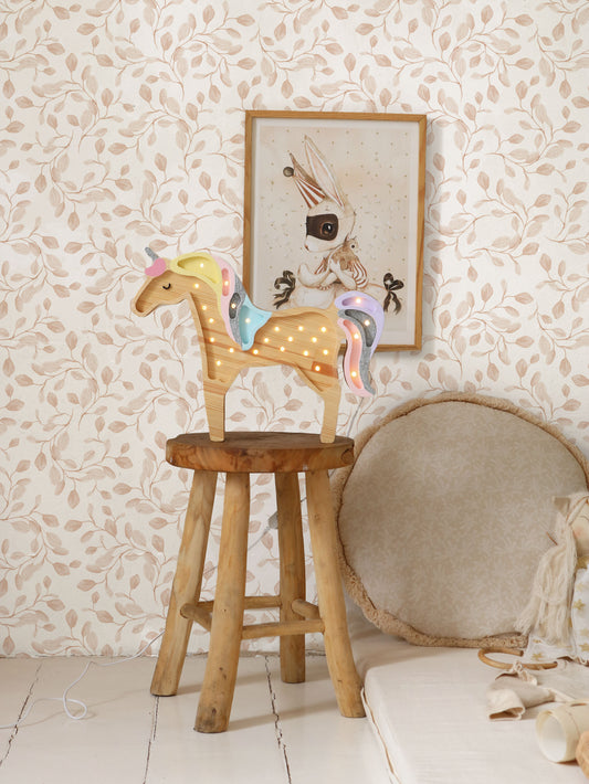 Matuu Eucalyptus Whimsy light brown wallpaper styled in natural nursery with wooden stool