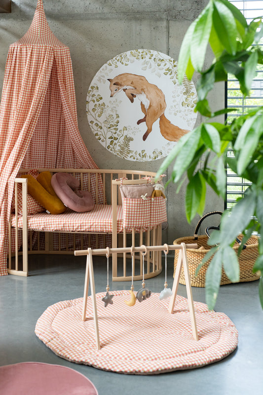 Boho nursery with Matuu fox wall decal – round forest animal sticker above wooden crib and natural decor.