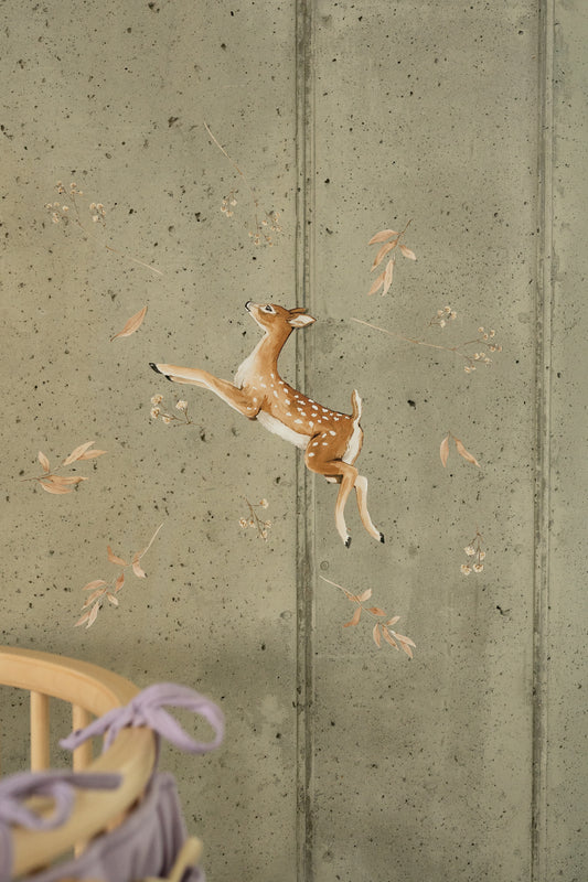Matuu running deer wall sticker on concrete wall in baby room with lavender decor.