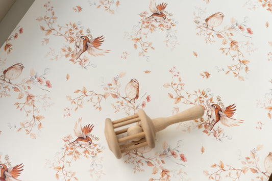 Matuu Brunch on Branches wallpaper – detailed bird and branch pattern on a soft cream-pink background.