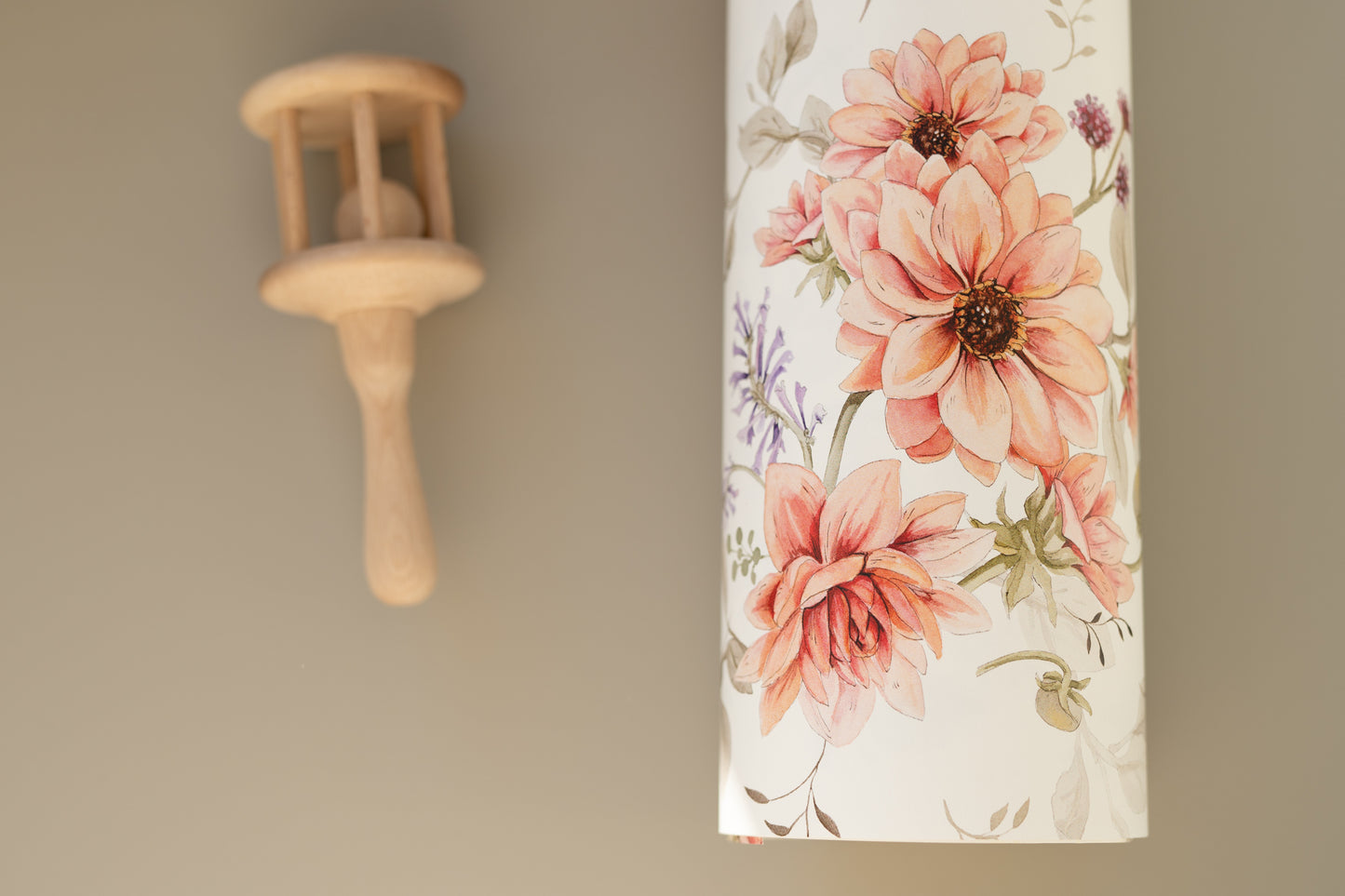Matuu Wild Roses wallpaper styled in cozy kids’ room with cream and beige accessories