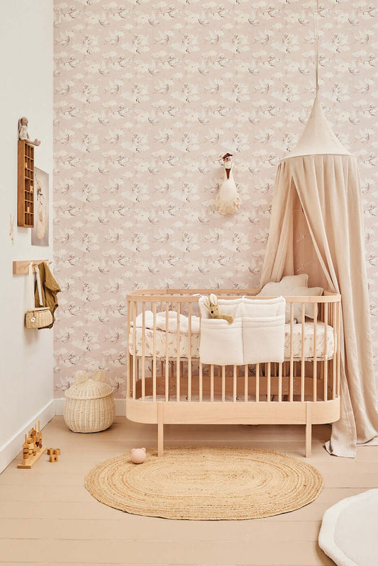 Matuu Magic Swan beige wallpaper styled in nursery, baby girl room decor with canopy, dreamy wall design