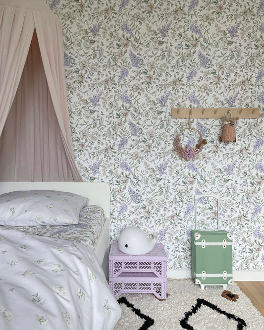 Matuu May Garden white wallpaper in child’s room with light pink canopy and cozy decor