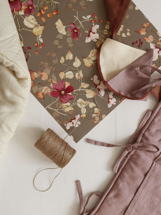 Matuu Burgundy Barberries wallpaper rolled-up view showing burgundy floral pattern on green background