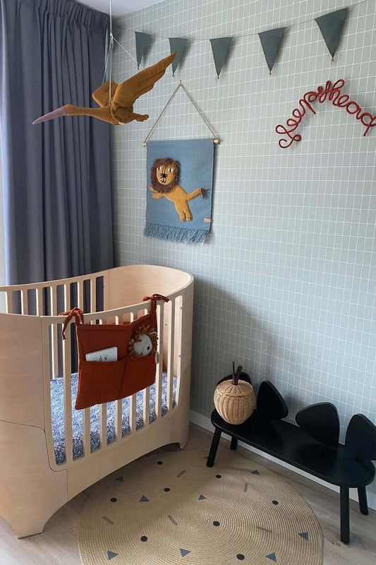Terracotta crib pocket by Matuu – warm, bold color adds character to the nursery while offering smart and stylish storage.