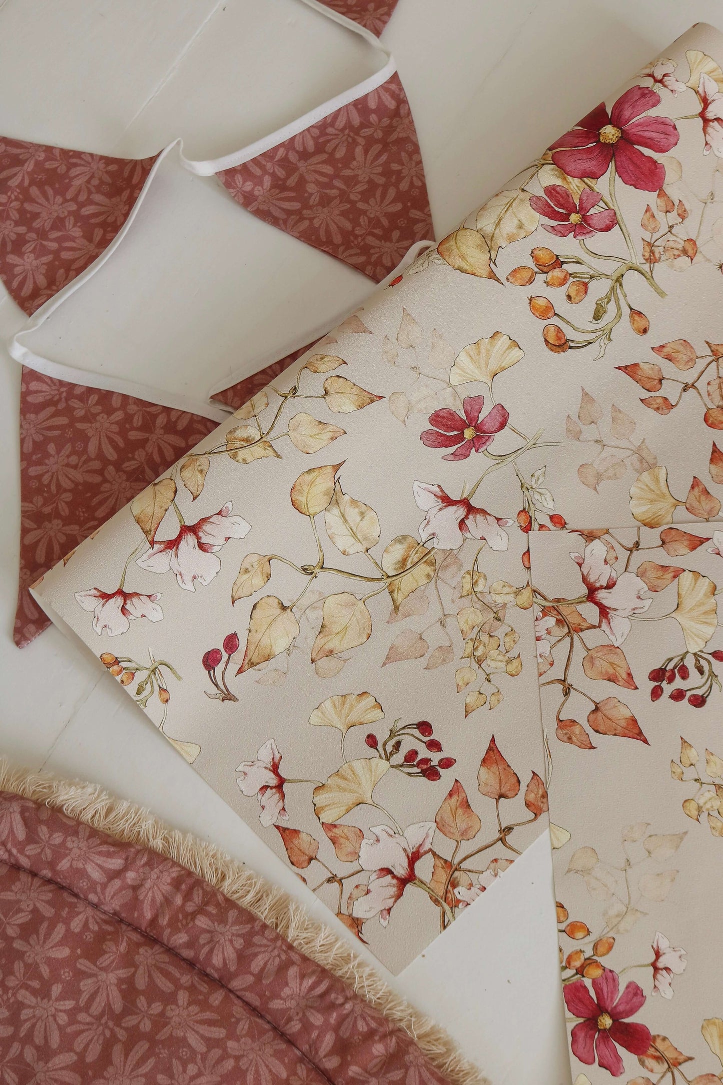 Matuu Indian Summer on beige wallpaper styled with natural decor and warm textures