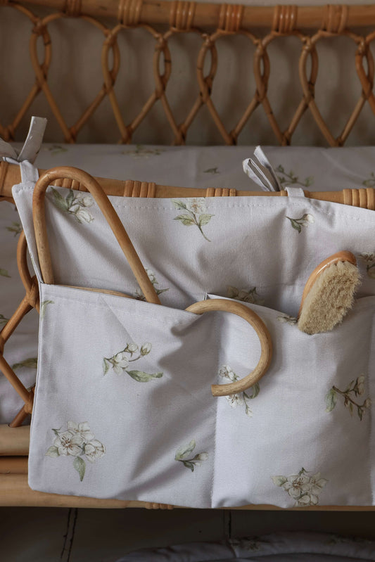 Close-up of Matuu organizer in “Apple Blossom on Lilac” – calm, muted lilac tones paired with a sweet blossom print for stylish and functional baby storage.