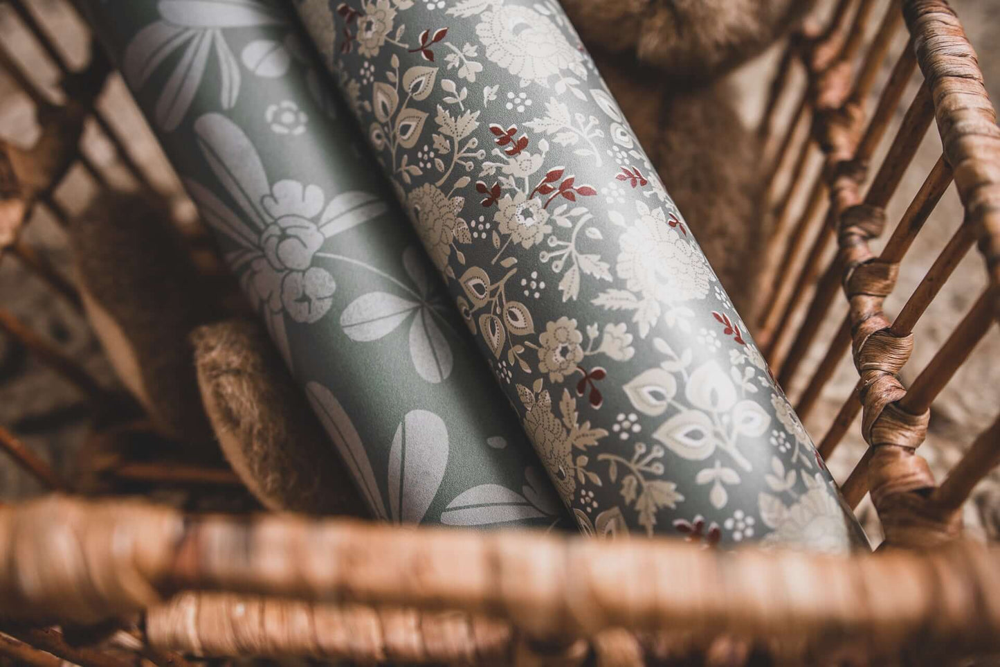 Matuu – Retro Small Green Flower and Grey Botanical wallpaper rolls in a woven basket, close-up texture view