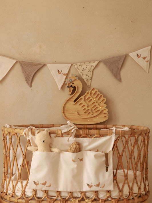 Close-up of Retro Hens bed pocket – detailed view of the playful hen pattern and soft neutral background.