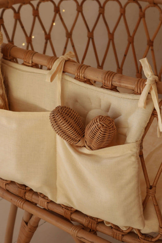 Side view of Matuu cream bed pocket – soft natural tones and heart detail for cozy storage