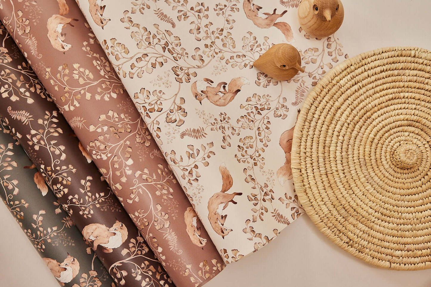 Detailed flat lay of Playful Fox on Beige wallpaper roll with kids’ decor, handmade woodland style
