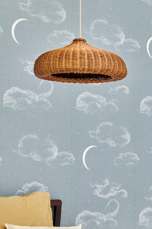 Matuu The Night Sky light blue wallpaper close-up with woven lamp and soft decor
