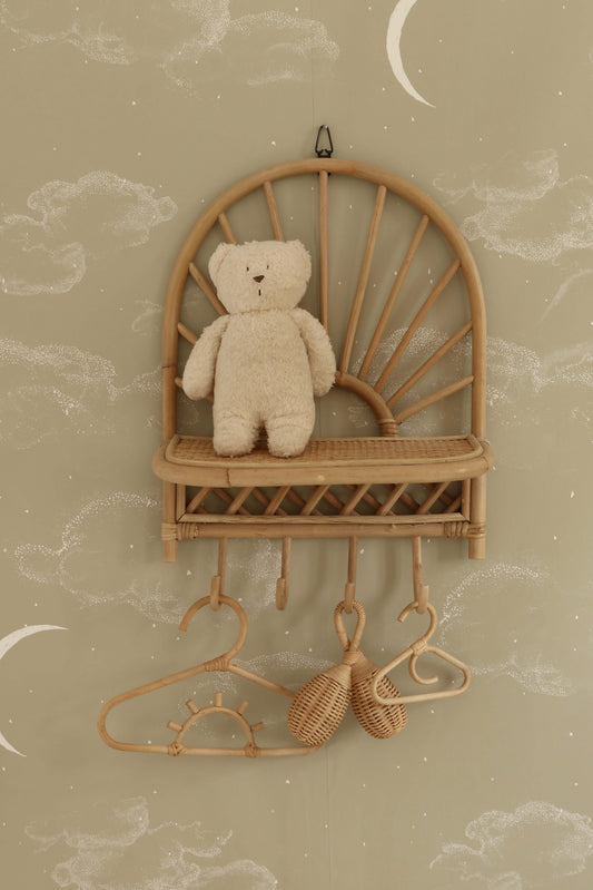 Matuu The Night Sky ecru wallpaper close-up with wooden shelf and delicate star pattern