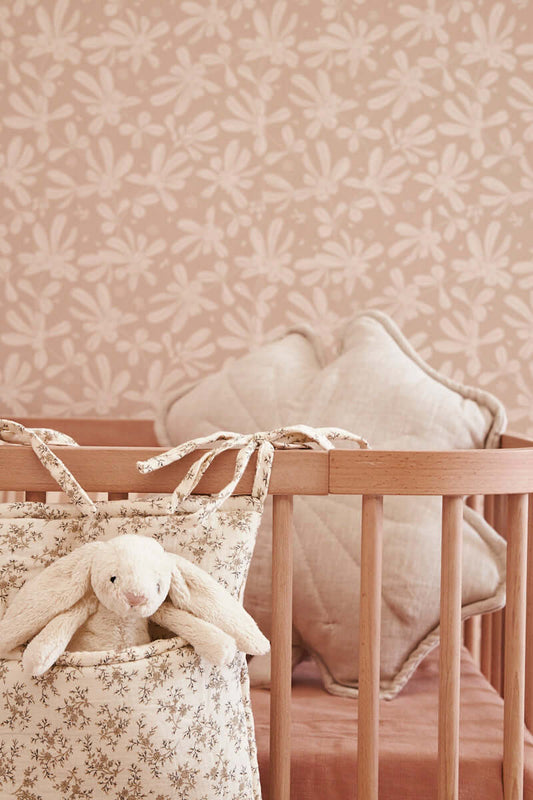 Close-up of Matuu crib organizer – vintage-inspired floral pattern with cotton ties on a wooden crib
