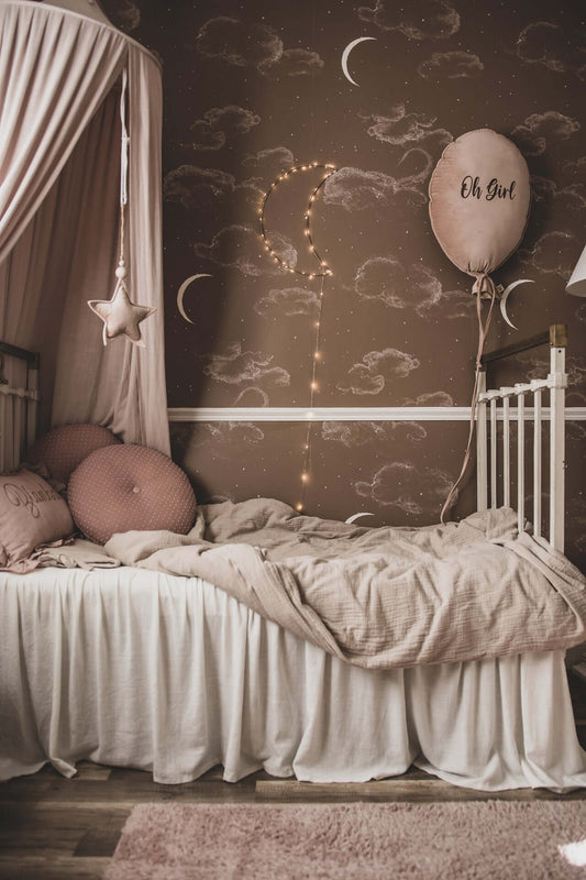 Matuu The Night Sky brown wallpaper in kids’ room with canopy and pink bedding