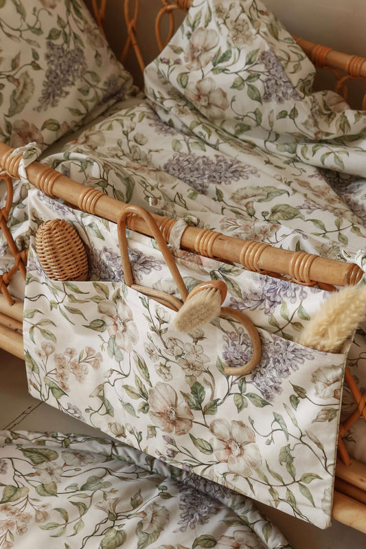 Close-up of Matuu organizer in “May Garden” – detailed botanical print and cotton texture, designed for practical and beautiful baby storage.