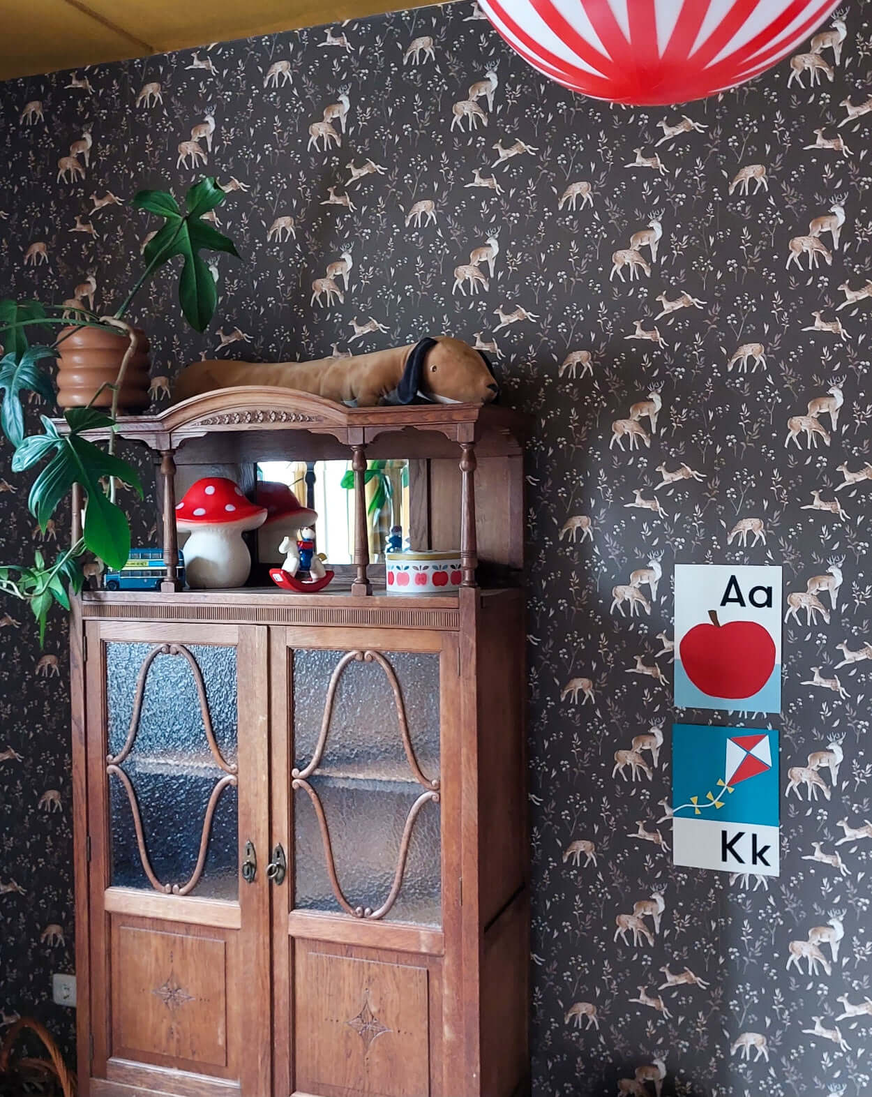 Matuu Deer Glade brown wallpaper sample close-up with rolled and flat sections