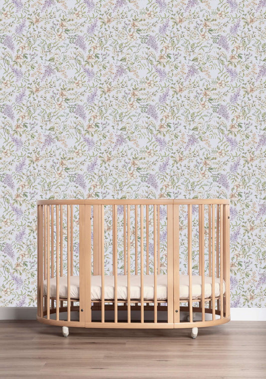 Matuu May Garden light blue wallpaper in nursery room with wooden crib and airy decor