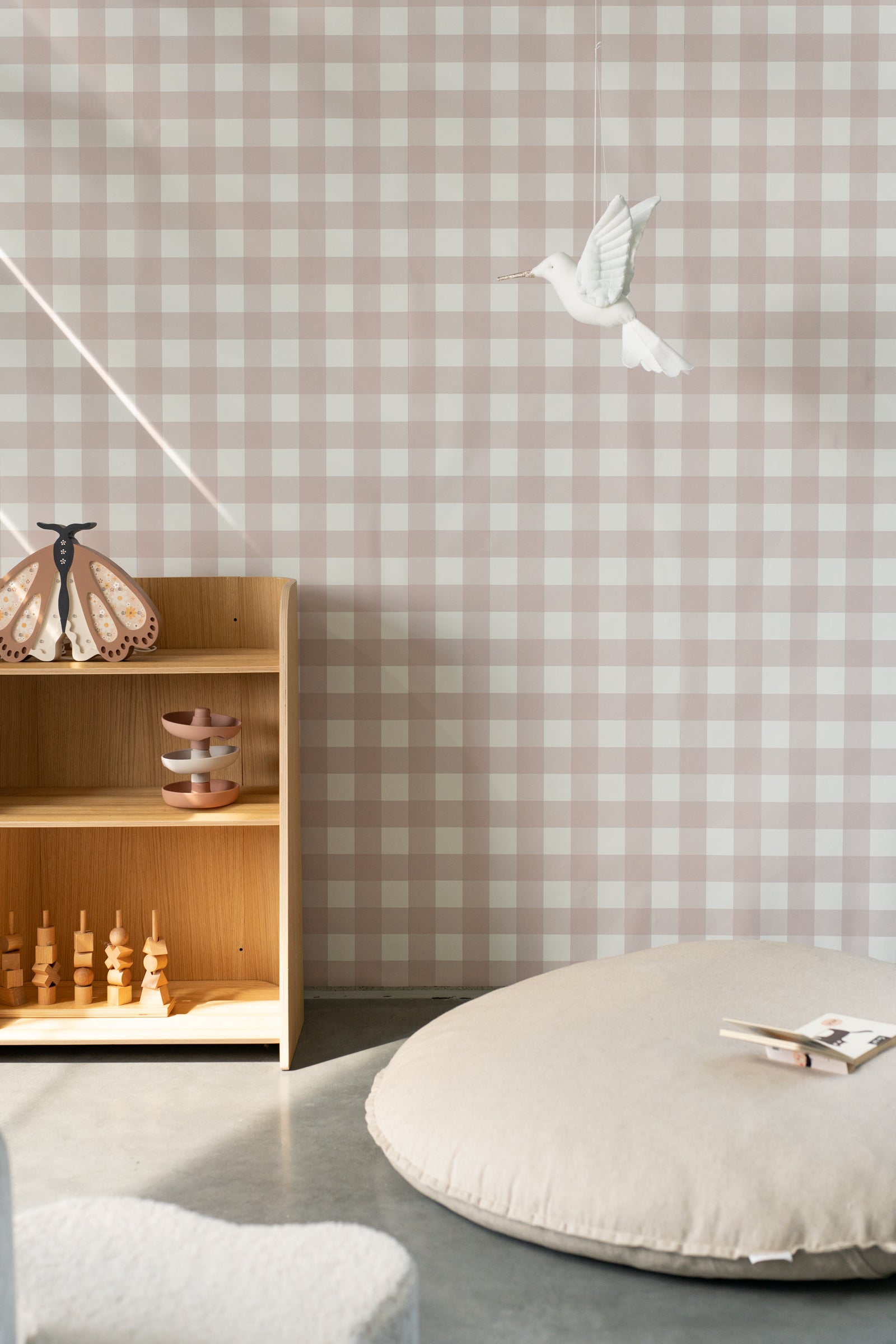 Matuu Cream Picnic cream gingham wallpaper in nursery with wooden furniture – warm interior style