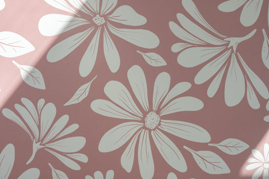 Matuu Deep Rose wallpaper – close-up of bold white daisies on a muted deep rose background.