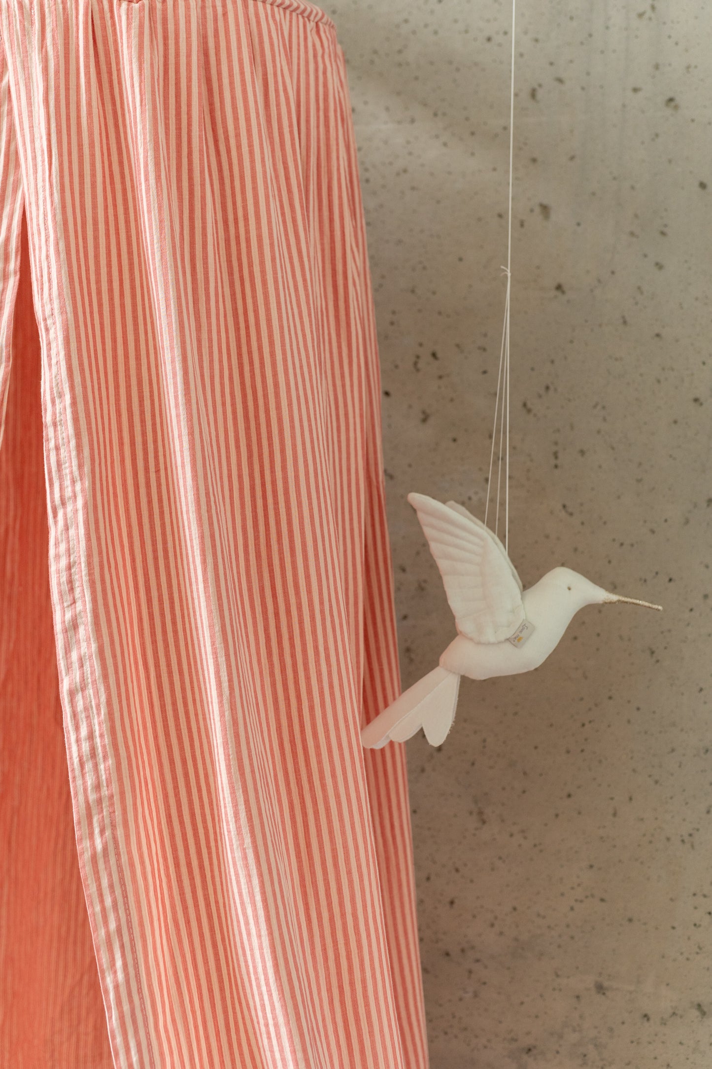 Matuu Blush Stripes muslin canopy with floral wallpaper – stylish kids’ room decor