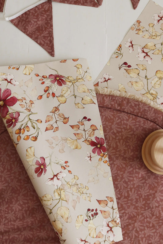 Matuu Indian Summer on beige wallpaper rolled-up view showing botanical design and earthy tones